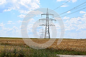 electric pylons in the grain fields