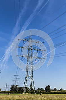 Electric pylons transporting electricity through high tension ca