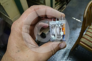 Electric relays with normally open and normally closed contacts in the hand