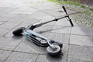 Electric Scooter Lying On Street photo