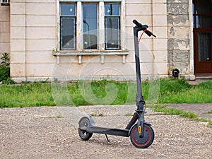 Electric scooter near old building