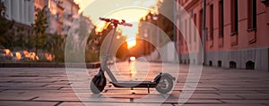 Electric scooter silhouetted at sunset in city photo