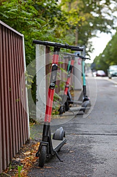 Electric scooters parked across the street.