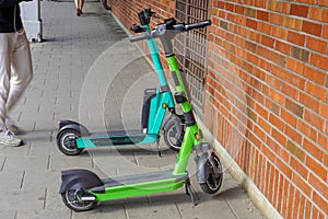 Electric scooters are parked in the city center