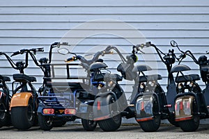 Electric scooters parked in a row.