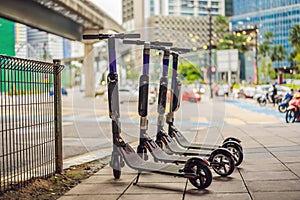 Electric scooters for rent. urban transport. Electric Ride Sharing Scooters Lined Up and Ready to Rent