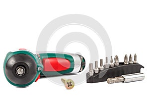 Electric screwdriver with interchangeable bits on white background. photo