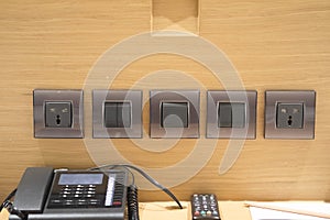 Electric socket and light switch panel and phone