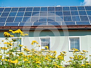 Electric solar panels on the roof of a beautiful modern house photo