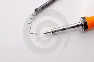 Electric soldering iron with wire on the side isolated on white surface