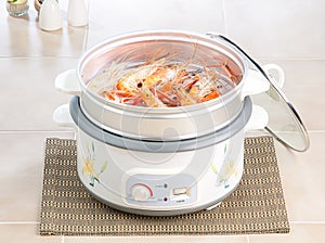 Electric steaming pot