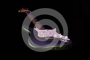 Electric stratocaster type guitar isolated on black background