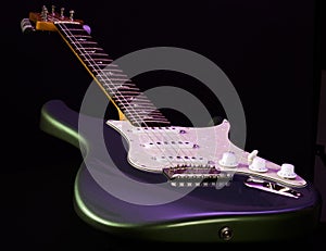 Electric stratocaster type guitar isolated on black background