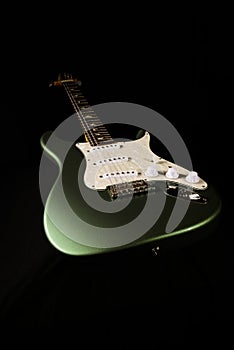 Electric stratocaster type guitar isolated on black background