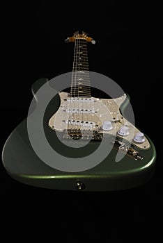 Electric stratocaster type guitar isolated on black background