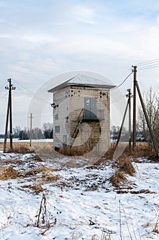 An electric substation in the village at winter