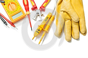 Electric tester digital multimeter wire strippers leathergloves isolated