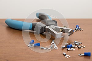 Electric tool, blue wire stripper on a wood table