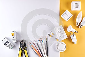 Electric tools set with dimmer switch isolated on yellow white background with copy space, controllable lighting