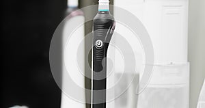 Electric toothbrush in bathroom