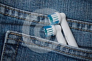 Electric toothbrushes refill in blue jeans pocket