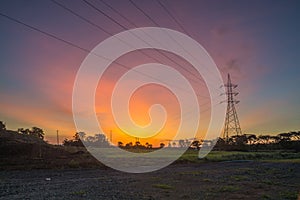 Electric Tower with Cable against Twilight Sky