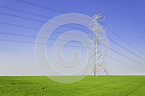 Electric tower on green field