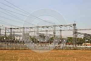 Electric towers connected with cords under the blue sky
