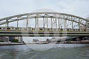 Electric train on the bridge over the Tokyo Sumida River