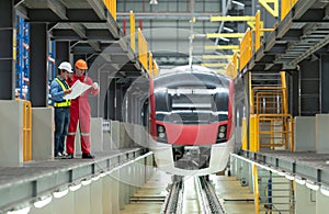 After the electric train is parked in the electric train repair shop, Electric train engineer and technician