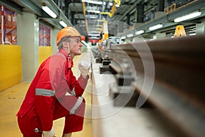 After the electric train is parked in the electric train repair shop, an electric train technician with tools inspect the railway