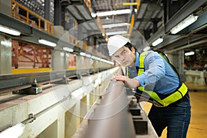 After the electric train is parked in the electric train repair shop, an electric train technician with tools inspect the railway