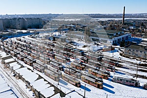 Electric trams at tram depot, aerial drone view