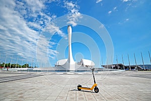 Electric transport rental in the park for a walk. parking for electric scooters. the concept of ecological transport for people.