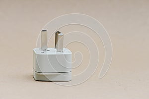 Electric travel plug with brown background