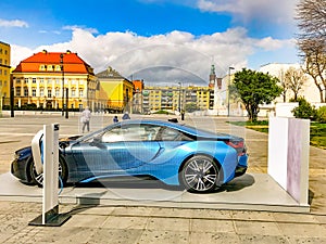 Electric vehicle being plugged in