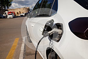 Electric vehicle charging station in parking lot at Alcudia, Mallorca