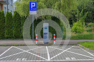 Electric vehicle charging station with two parking spaces