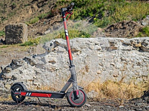 Electric scooter on rocky lands photo