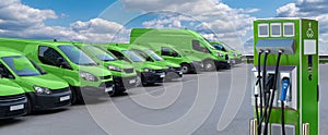 Electric vehicles charging station on a background of a row of vans photo