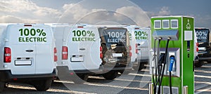 Electric vehicles charging station on a background of a row of vans photo