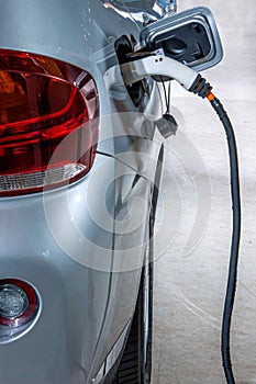 Electric vehicles and electric vehicle charging stations