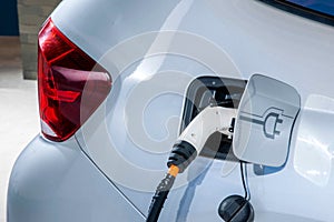 Electric vehicles and electric vehicle charging stations