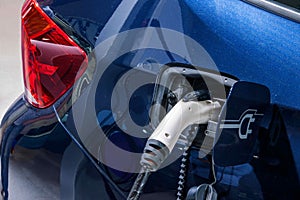 Electric vehicles and electric vehicle charging stations