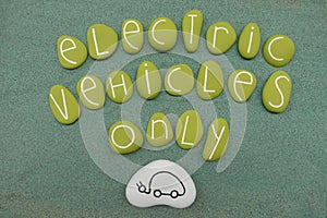 Electric Vehicles Only text with green colored stones over green sand