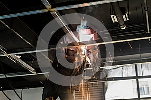 Electric welder in construction site