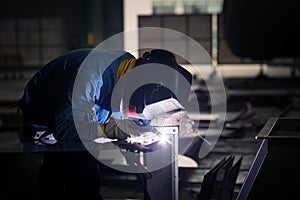 Electric welder at work