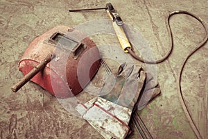 Electric welding machine, electric wire, masks, gloves and tongs, are very old