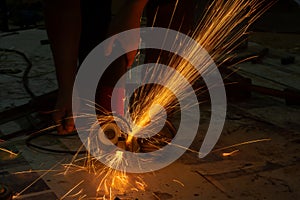 Electric wheel grinding cuting on steel. sparks from cutting