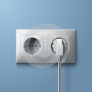 Electric white plug and socket on blue wall